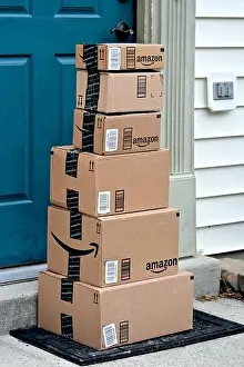 E Commerce Prints: Amazon boxes delivered to a home