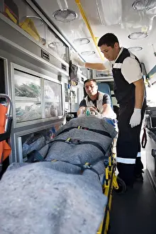 Lying Down Prints: Ambulance staff and patient on stretcher