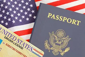 Citizenship Prints: American Passport Close Up With Drivers License on Top of USA Flag