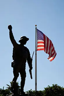 Silhouetted Prints: American soldier statue and American flag in Sarasota Florida
