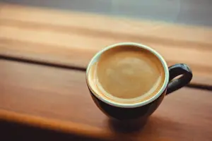 Heart Shape Prints: americano coffee on a side of the window in the morning