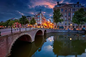 Downtown District Prints: Amsterdam. Image of Amsterdam, Netherlands during dramatic sunrise