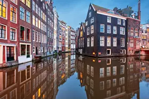 Alleyway Prints: Amsterdam, Netherlands with narrow canals and buildings lining them in the morning time