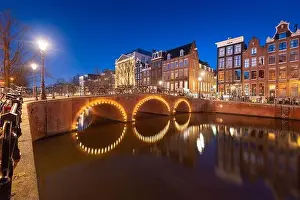 Amsterdam, Netherlands view of the cityscape on the canals at night