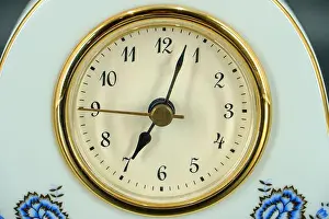 Timer Prints: Analog alarm clock on table in bedroom. Time of day