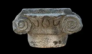 Basalt Prints: ancient greek ionic style basalt stone capital from the katzrin open air museum in the golan heights in israel isolated