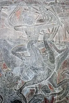 Goose Prints: Ancient Khmer bas relief carving showing the Hindu god of creation Lord Brahma riding into battle on the sacred goose