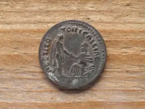 Restoring Prints: Ancient Roman denarius coin reverse side showing restoration of Gaul by emperor Hadrian circa 130 bC
