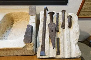 Cutter Prints: Ancient Stone cutters hand tools at the Ethnological Museum Mijas, Andalusia, Spain