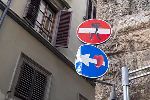 Street Sign Prints: An angel carries a Do Not Enter sign, done by artist Clet, in Florence, Italy