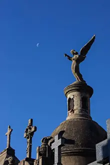 Buenos Aires Prints: Angel pointing toward the moon from the dome of a mausoleum in Recoleta Cemetery