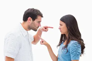 Solemn Prints: Angry couple pointing at each other on white background