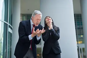 Desperate Prints: Angry and desperate business people arguing with each other