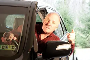 Threaten Prints: Angry driver leaning out of window making threatening gestures