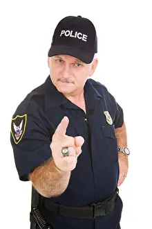 Grumpy Prints: Angry looking police officer pointing his finger at you Isolated on white