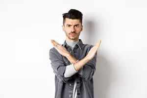 Outraged Prints: Angry man show cross gesture to stop or say no