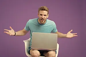 Unshaven Prints: Angry man with laptop on violet background
