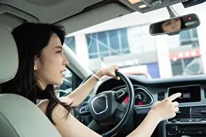 Only Women Prints: The angry young woman driving a car