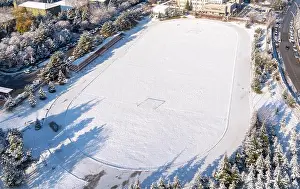 Top Tree Prints: Ankara/Turkey-December 13 2018 - Aerial view of football field with green grass covered with snow in winter