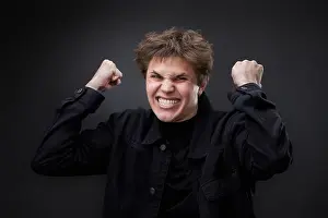 Displeased Prints: annoyed angry man in furious gesture on black background