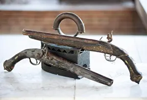 Cartridge Prints: Antique charcoal iron and antique patterned revolvers with forged grips