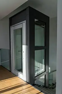 Rent Prints: Apartment interior with modern glass elevator. Architecture design in building