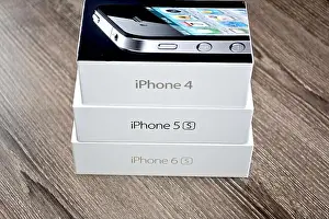 Iphone Prints: Apple iPhone box on a wood surface