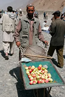 Afghanistan Prints: Apple vendor on the transborder market near Ishkashim on the border between Tajikistan and Afghanistan