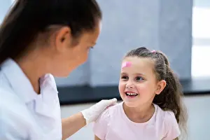 Injured Prints: Applying Band Aid To Children Wound. Kid Bandage
