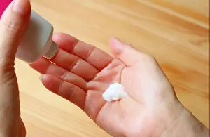 Lotion Prints: Applying hand lotion into palm for hand moisturizing