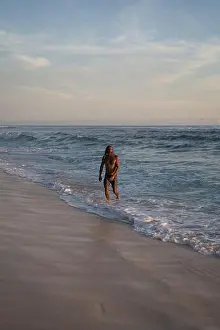 Curly Hair Prints: An Arab man with long curly hair swims in the ocean