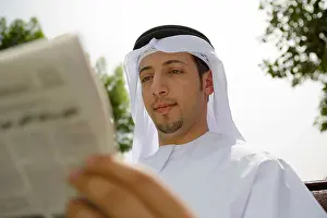 Differential Focus Prints: Arab Man Reading Newspaper on Park Bench