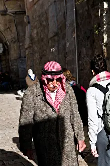 Headwear Prints: An Arab man wearing a traditional red Kafia in the old city of Jerusalem