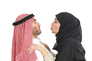 Kiss Prints: Arab saudi obsessed woman kissing desperately a man isolated on a white background