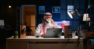 Arabic job candidate remotely being interviewed by HR worker while at home. Middle Eastern man getting his credentials checked during online video