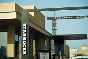 Saudi Arabia Prints: Arabic Starbuck drive-thru sign, Starbucks sign downtown. Saudi Arabia