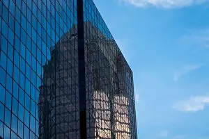 High View Prints: Architecture details of modern skyscraper building with blue sky in Montreal, Canada