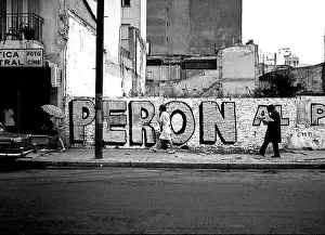 Dictator Prints: ARG 252A Mar Del Plata 1973 Peron for president sign street scene with people walking by