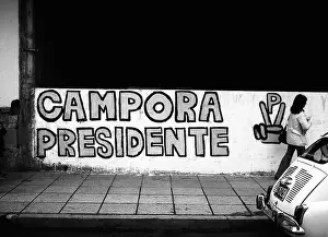 Dictator Prints: ARG 255B Mar Del Plata Argentina 1973 presidential campaign wall painting with passerby