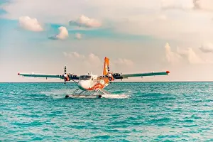 Ari Atoll, Maldives - 05.05.19: Seaplane at tropical beach resort. Luxury summer travel destination with seaplane in Maldives islands. Exotic vacation