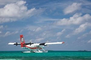 Images Dated 14th December 2015: Ari Atoll, Maldives - 05.05.2018: Maldives seaplane on luxury resort, wooden jetty loading the plane