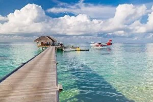 Images Dated 14th December 2015: Ari Atoll, Maldives - 05.05.2018: Maldives seaplane on luxury resort, wooden jetty loading the plane