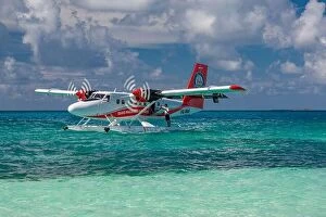 Images Dated 16th December 2015: Ari Atoll, Maldives - 05.05.2019: Maldives seaplane on luxury resort, wooden jetty loading the plane