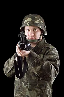 Brave Prints: Armed man pointing a rifle