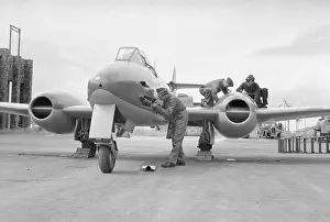 Wiltshire Prints: An armourer and two engine fitters work on a Gloster Meteor F Mark III at the Aeroplane
