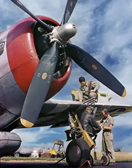 On The Ground Prints: Armourers loading ammunition and bombs on a Republic P-47 Thunderbolt