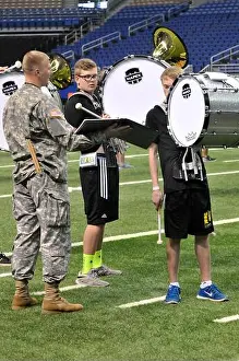 Rehearsal Prints: Army Band mentors assist high school musicians and color guard members at the Alamodome in San Antonio