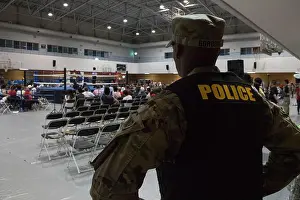 Boxing Prints: An Army Reserve Soldier from the 200th Military Police Command provided security during a professional boxing