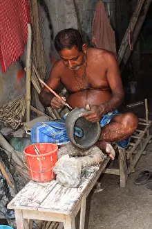 Kolkata Prints: One of the Artisans of Kumartuli working on an idol