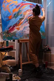 Oil Paint Prints: Artist painting with hands creating a masterpiece on large canvas